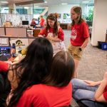 Everett Herald staff gather and talk in the newsroom after layoff announcements on Wednesday, June 19, 2024 in Everett, Washington. (Olivia Vanni / The Herald)