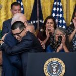 President Joe Biden hugs Javier Quiroz Castro, who benefitted from the Deferred Action for Childhood Arrivals program, during an anniversary event for DACA in the East Room at the White House on Tuesday, June 18, 2024. President Biden on Tuesday announced sweeping new protections for hundreds of thousands of immigrants who have been living in the United States illegally for years but are married to American citizens. (Haiyun Jiang/The New York Times)