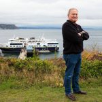 Nichols Brothers Boat Builders Matt Nichols stands overlooking the National Geographic Venture, a 238-foot cruise boat built at NBBBs Freeland facility, on Thursday, Oct. 25, 2018, in Langley, Washington. (Andy Bronson / The Herald)