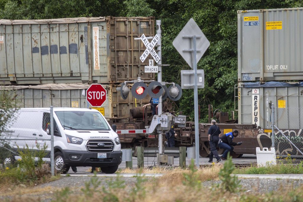 Law enforcement respond to a person hit by a train near the Port of Everett Mount Baker Terminal on Thursday, June 27, 2024 in Mukilteo, Washington. (Annie Barker / The Herald)