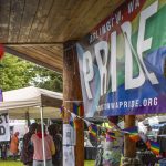 Pride flags are displayed during the third annual Arlington Pride event on Sunday, June 2, 2024 in Arlington, Washington. (Annie Barker / The Herald)