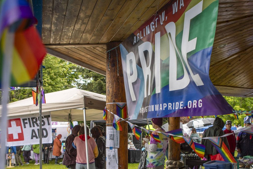 Pride flags are displayed during the third annual Arlington Pride event on Sunday, June 2, 2024 in Arlington, Washington. (Annie Barker / The Herald)