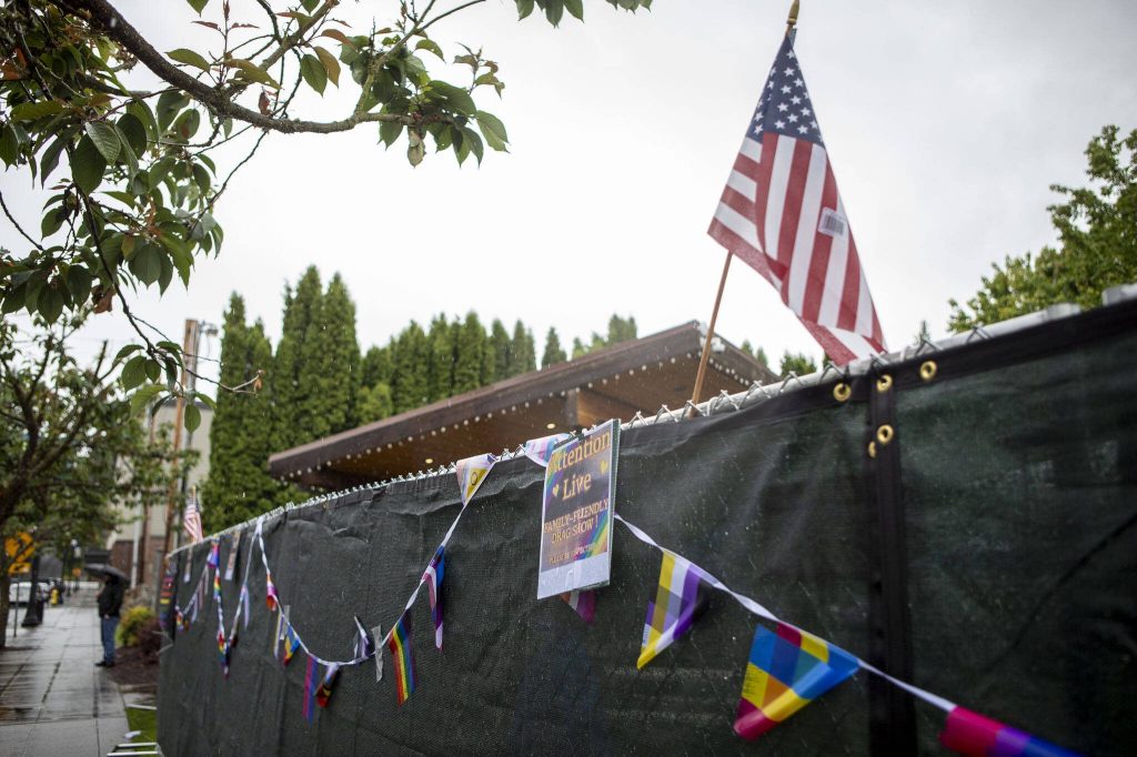 Pride and American flags are displayed during the third annual Arlington Pride event in Arlington, Washington on Sunday, June 2, 2024. (Annie Barker / The Herald)