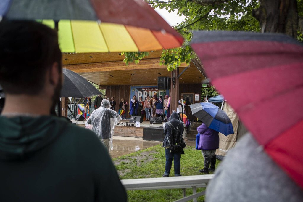 People watch the main stage during the third annual Arlington Pride event in Arlington, Washington on Sunday, June 2, 2024. (Annie Barker / The Herald)