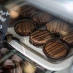 Peanut butter cups are displayed inside Sweet Monas Chocolates. (Annie Barker / The Herald)