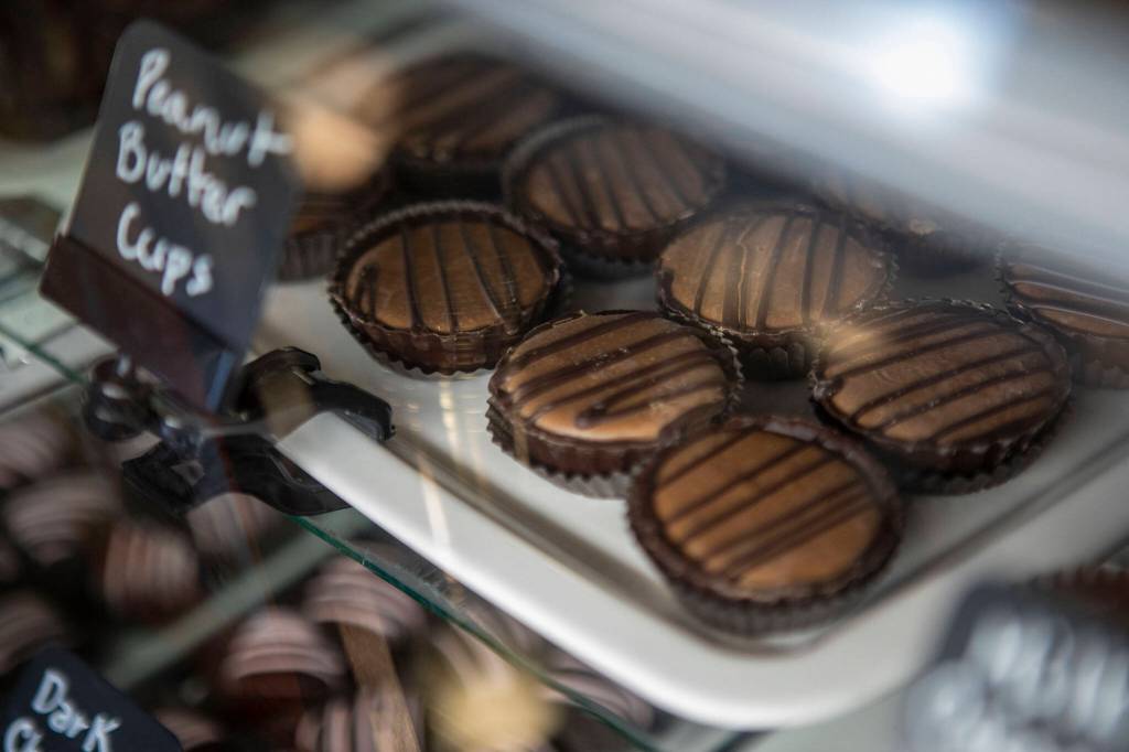 Peanut butter cups are displayed inside Sweet Monas Chocolates. (Annie Barker / The Herald)