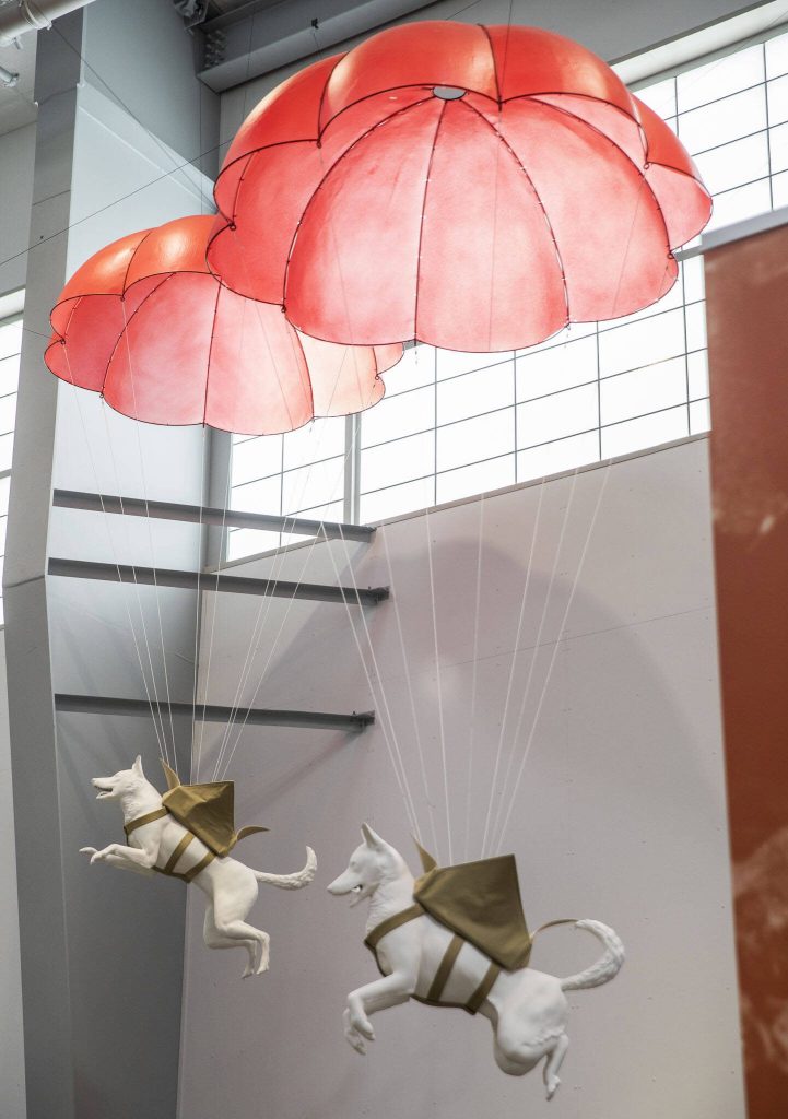 3D-printed dogs demonstrate how some dogs in war would jump and parachute from planes in the Charlie Hangar of the Flying Heritage & Combat Armor Museum on Friday, March 29, 2024 in Everett, Washington. (Olivia Vanni / The Herald)
