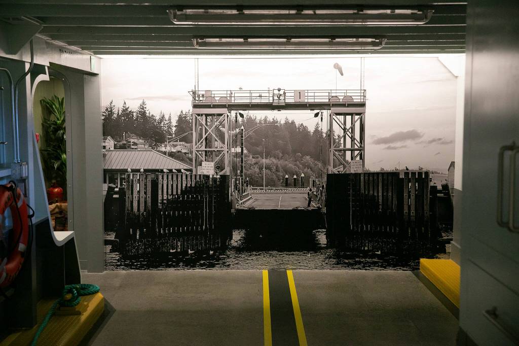 A photo depicting the Clinton ferry landing is on a wall at the Ferry Cove rental property on May 29, 2024, in Clinton. (Ryan Berry / The Herald)