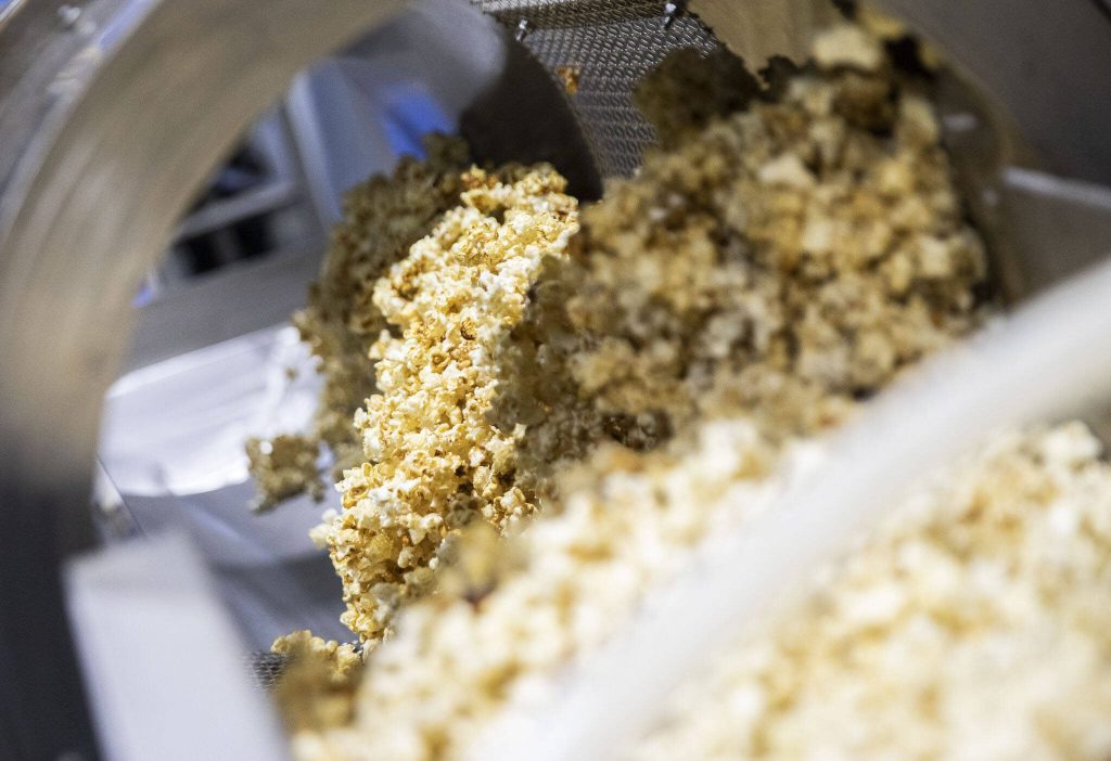 Kettle corn is processed at Jaspens on Tuesday, June 18, 2024 in Monroe, Washington. (Olivia Vanni / The Herald)