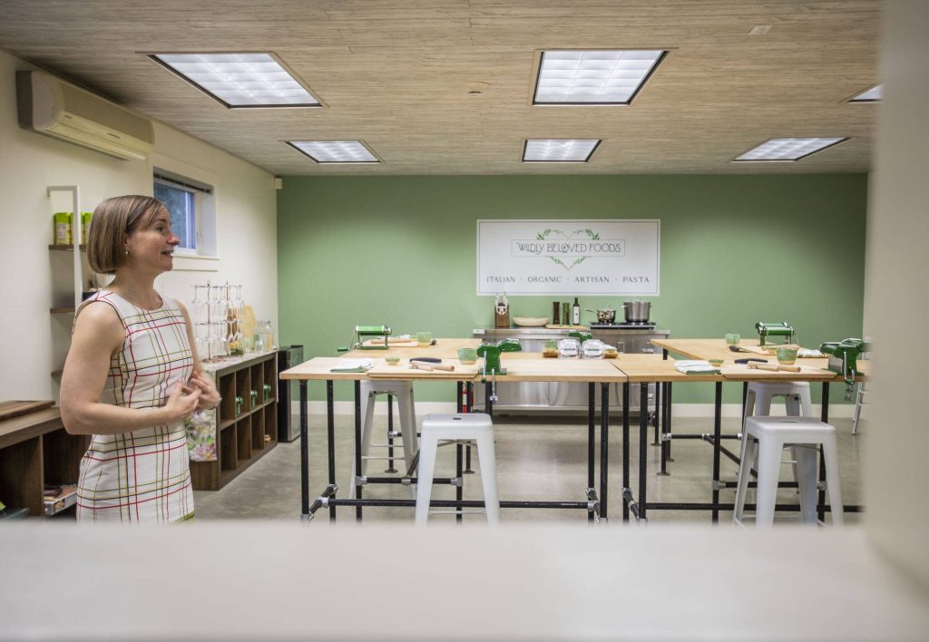 Aurora Echo talks about the renovations made to create the space for Wildly Beloved Foods on Thursday, June 27, 2024 in Clinton, Washington. (Olivia Vanni / The Herald)