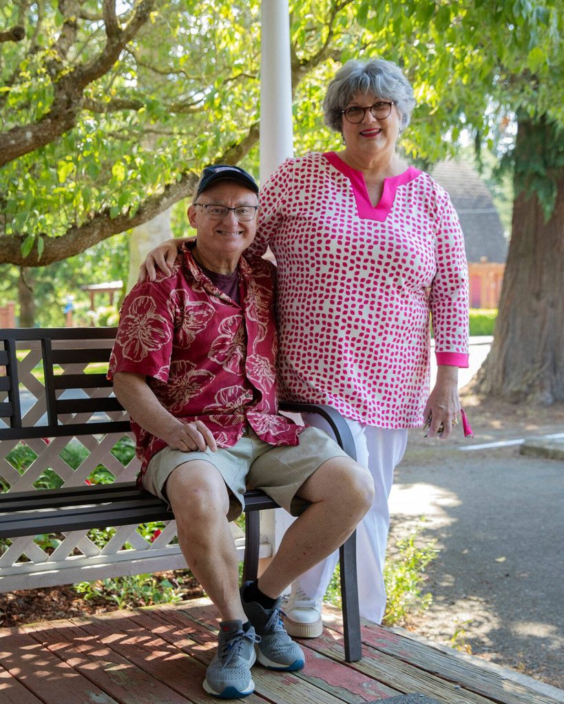 Robin Sparks and her husband Gordon Sparks take a photo together in front of the C-Suite Center for Hope on Wednesday, July 3, 2024, in Marysville, Washington. (Ryan Berry / The Herald)