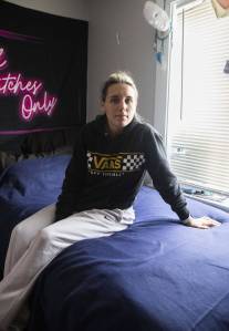 Photos by Olivia Vanni / The Herald
Gabby Bullock sits on her bed in a room she shares with another housemate on June 14 in Everett.