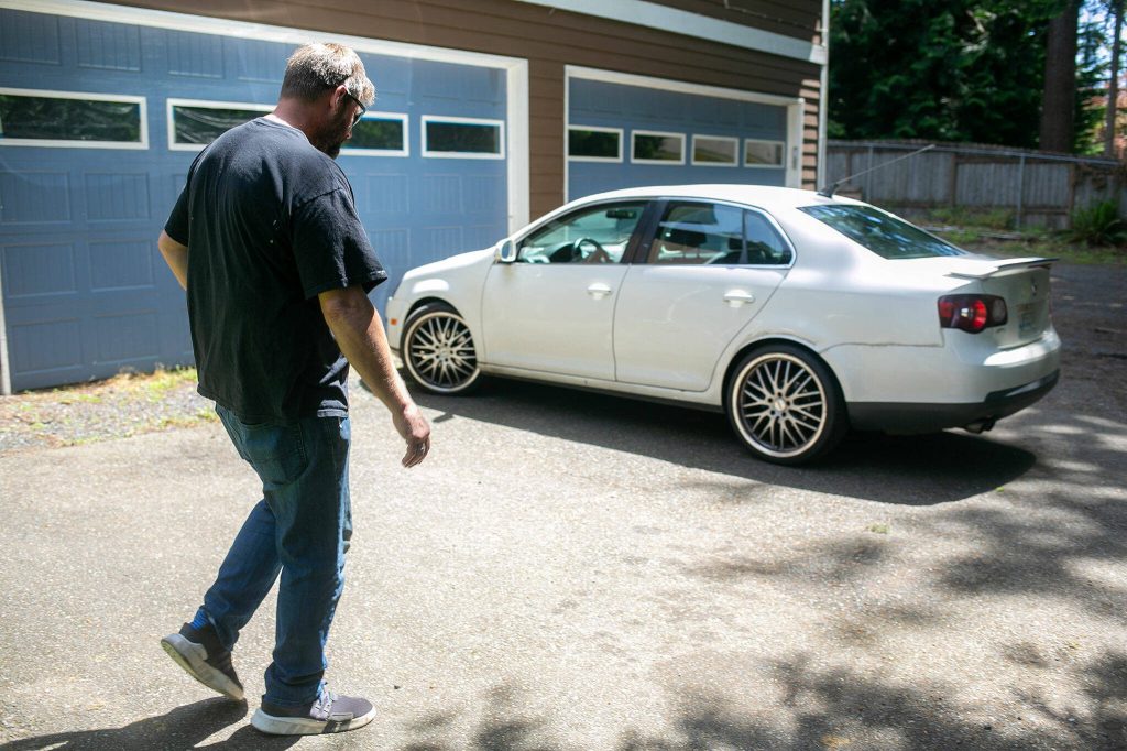 Alford Leroy Ross heads out for the day with a couple others from a Hand Up Housing residence on May 31, 2024, in Edmonds, Washington. (Ryan Berry / The Herald)