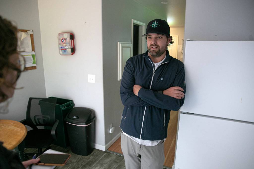 Travis Gannon, founder of Hand Up Housing, takes part in an interview at one of the residences on May 31, 2024, in Edmonds, Washington. (Ryan Berry / The Herald)