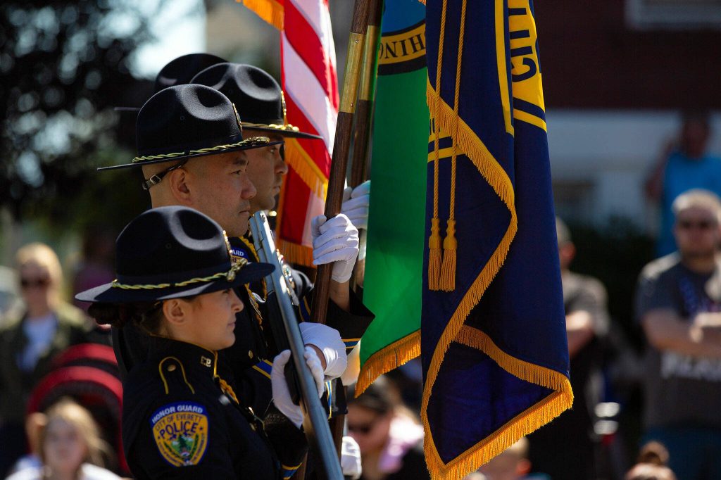 The Everett Police Honor Guard help lead Everetts Fourth of July Parade on Thursday, July 4, 2024, in downtown Everett, Washington. (Ryan Berry / The Herald)