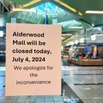 A sign seen from inside Macys informs customers that the Alderwood Mall is closed on Thursday, July 4, 2024, in Lynnwood, Washington (Andrea Brown / The Herald)