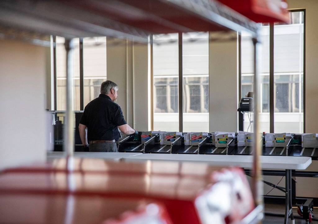 Test ballots are run through a sorting machine on Tuesday, July 9, 2024 in Everett, Washington. (Olivia Vanni / The Herald)