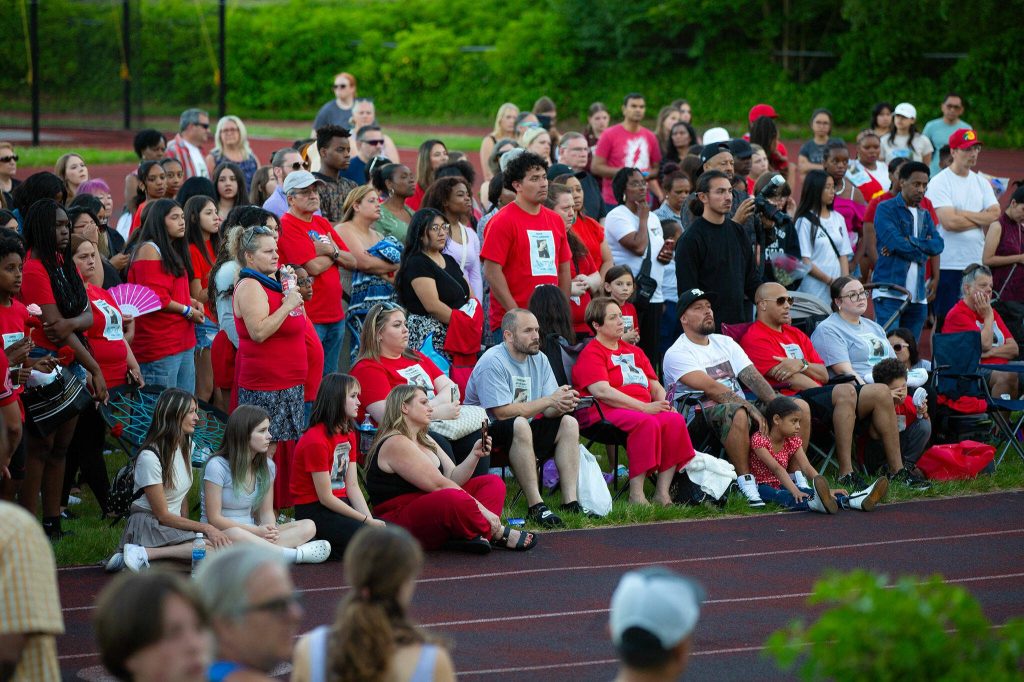 Family and loved ones are surrounded by their community during a vigil held in memory of Jayda Woods-Johnson at Mountlake Terrace High School on Sunday, July 7, 2024, in Mountlake Terrace, Washington. (Ryan Berry / The Herald)