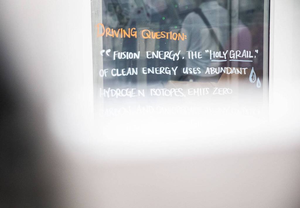 Quotes about fusion energy written on the windows of offices are visible on a tour of the Helion facility on Tuesday, July 9, 2024, in Everett, Washington. (Olivia Vanni / The Herald)