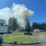 A house fire sends a column of smoke into the air, as seen from Olympic View Middle School, on Monday, July 8, 2024, in Mukilteo, Washington. (Jenelle Baumbach / The Herald)