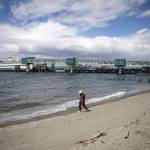 People walk near the Edmonds ferry terminal in Edmonds, Washington on Monday, June 3, 2024. (Annie Barker / The Herald)