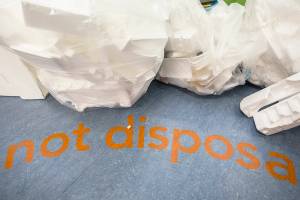 The words "not disposable" are printed on the ground next to the Styrofoam recycling area on Wednesday, Jan. 29, 2020 in Bothell, Wash. (Olivia Vanni / The Herald)