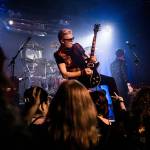 Dave Dodge stands on a speaker while playing his guitar during Nite Waves show at Tony Vs Garage on Saturday, June 8, 2019 in Everett, Wash. The 80s New Wave tribute band is set to kick off Everetts Music at the Marina concert series on Thursday. (Olivia Vanni / Herald file)
