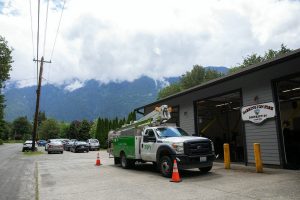 A Ziply Fiber truck is parked outside Darrington Fire District Station 38 during a press conference and groundbreaking for the SR 530 Broadband Project on Wednesday, June 26, 2024, outside Darrington, Washington. (Ryan Berry / The Herald)