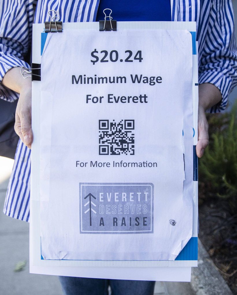 A sign displaying the $20.24 minimum wage goal of the petition on Thursday, July 11, 2024 in Everett, Washington. (Olivia Vanni / The Herald)