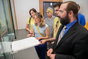 Members of “Everett Deserves a Raise” group turn in their signed patients to the the clerk at City Hall on Thursday, July 11, 2024 in Everett, Washington. (Olivia Vanni / The Herald)