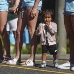 A child watches games during the Everett 3on3 tournament in downtown Everett, Washington on Sunday, July 14, 2024. (Annie Barker / The Herald)