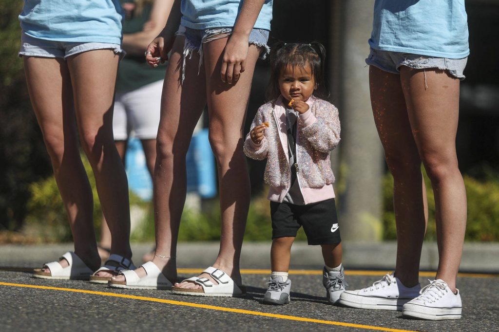 A child watches games during the Everett 3on3 tournament in downtown Everett, Washington on Sunday, July 14, 2024. (Annie Barker / The Herald)