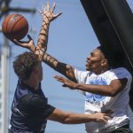 FAB and WeAreEverett face off in the 18 and older mens bracket during the Everett 3on3 tournament in downtown Everett, Washington on Sunday, July 14, 2024. (Annie Barker / The Herald)