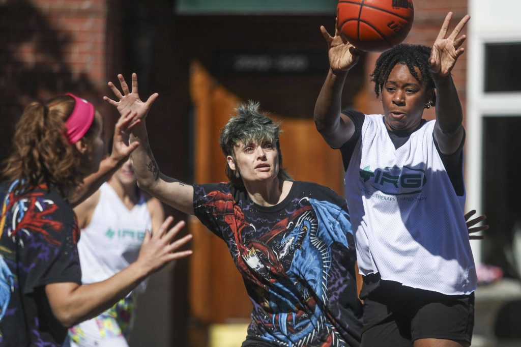The Bucket Getters and Lockdown face off in the over 18 year old female league during the Everett 3on3 tournament in downtown Everett, Washington on Sunday, July 14, 2024. (Annie Barker / The Herald)