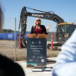 Port of Everett CEO Lisa Lefeber addresses a sizable gathering of people at a groundbreaking ceremony for Restaurant Row at the Port of Everett on Tuesday, July 23, 2024, in Everett, Washington. (Ryan Berry / The Herald)