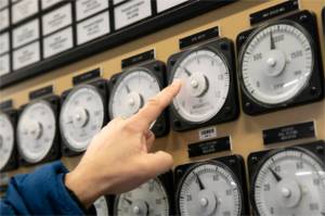 Scott Spahr, Generation Engineering Manager at Snohomish County PUD, points to a dial indicating 4 megawatts of power production from one of two Francis turbine units at the Henry M. Jackson Powerhouse on Friday, Feb. 17, 2023, near Sultan, Washington. Some of the water that passes through units 3 and 4 — the two Francis turbines — is diverted to Lake Chaplain, which supplies water to Everett. (Ryan Berry / The Herald)