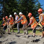 Officials toss some dirt with their golden shovels at the conclusion of a groundbreaking ceremony for the Reservoir 3 Replacement Project on Tuesday, July 23, 2024, in Everett, Washington. (Ryan Berry / The Herald)
