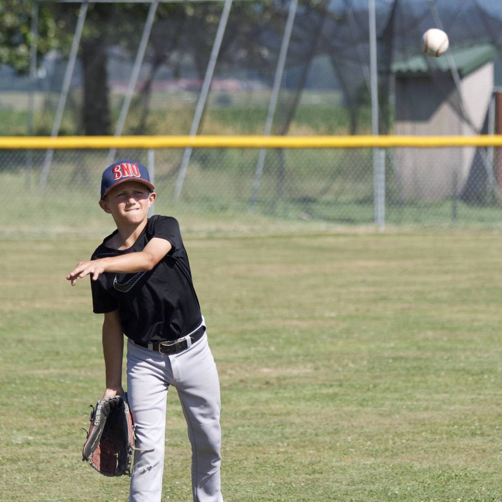 Will Garrett throws the ball during practice at the Snohomish Little League Complex in Snohomish, Washington on Thursday, July 18, 2024. (Taras McCurdie / The Herald)