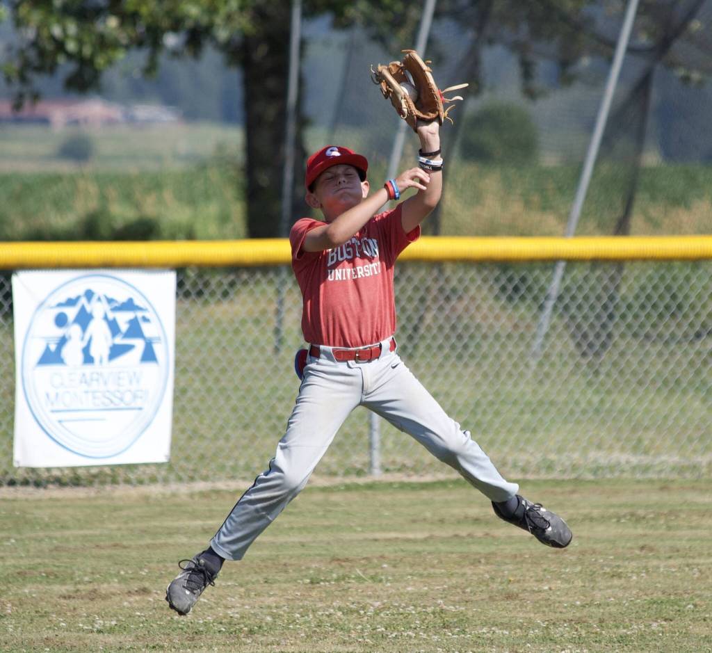 Grayson Davisson catches the ball during practice at the Snohomish Little League Complex in Snohomish, Washington on Thursday, July 18, 2024. (Taras McCurdie / The Herald)