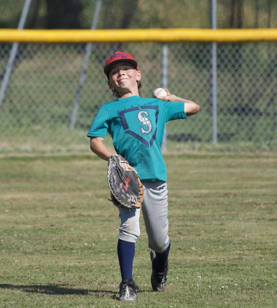 Carter Bales throws the ball during practice at the Snohomish Little League Complex in Snohomish, Washington on Thursday, July 18, 2024. (Taras McCurdie / The Herald)