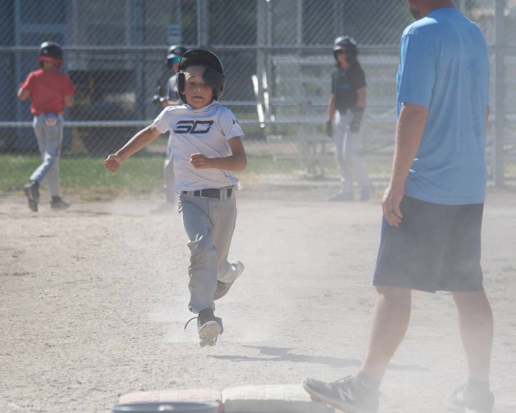 Koa Hoolulu runs to first base during practice at the Snohomish Little League Complex in Snohomish, Washington on Thursday, July 18, 2024. (Taras McCurdie / The Herald)