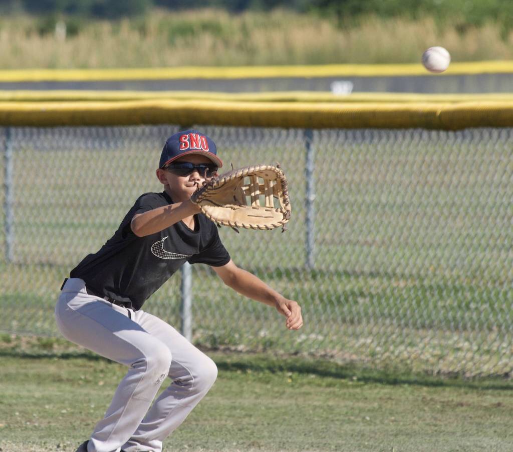 Will Garrett prepares to catch the ball during practice at the Snohomish Little League Complex in Snohomish, Washington on Thursday, July 18, 2024. (Taras McCurdie / The Herald)