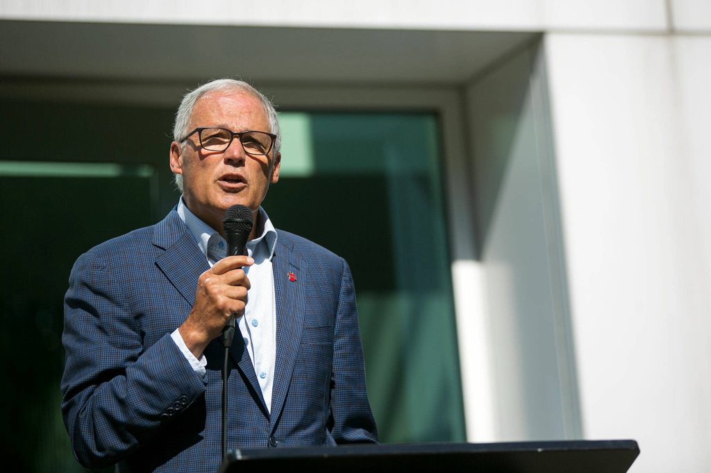 Gov. Jay Inslee speaks about mental health action and the VOA’s Behavioral Health Crisis Call Center during a presser outside of the call center’s office on Thursday, July 28, 2022, in Everett, Washington. (Ryan Berry / The Herald)