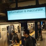 A malfunctioning informational sign at the 42nd Street subway station on Eighth Avenue in Manhattan on Friday morning, July 19, 2024. Businesses, websites and airlines struggled to slowly recover on Friday from an extensive global technology outage that took down airlines, medical services, TV broadcasts, banks and scores of other businesses and services around the world. (Graham Dickie/The New York Times)