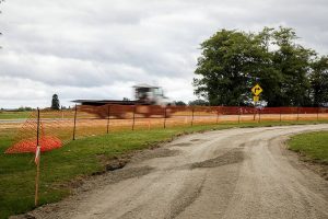 A truck drives past the second phase of the Port Susan Trail construction on Thursday, July 25, 2024 in Stanwood, Washington. (Olivia Vanni / The Herald)