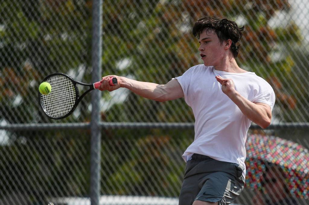 Archbishop Murphys Cole Balen hits the ball during the boys singles championship match at Snohomish Summer Smash at Snohomish High School in Snohomish, Washington on Sunday, July 21, 2024. (Annie Barker / The Herald)
