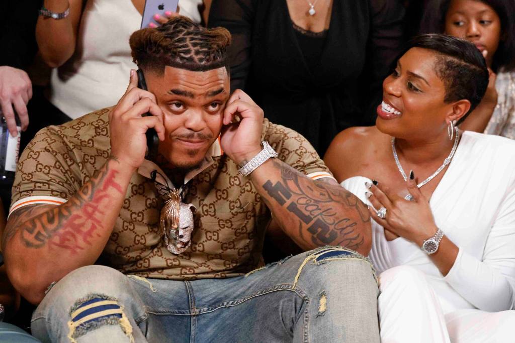 Texas defensive tackle Byron Murphy II, from DeSoto, takes a phone call before being drafted by the Seattle Seahawks as the No. 16 overall pick. His mother, Seneca Murphy, reacts during a NFL draft watch party, on Thursday, April 25, 2024, at The Statler Dallas. (Shafkat Anowar / Tribune News Service)