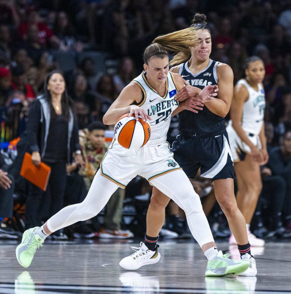 New York Liberty guard Sabrina Ionescu (20) fights off Aces guard Kelsey Plum (10) during the second half of their WNBA game at Michelob Ultra Arena on Saturday, June 15, 2024, in Las Vegas. (L.E. Baskow / Las Vegas Review-Journal)