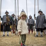 Orion Muhic, 2, holds a toy flute at the Washington Midsummer Renaissance Faire near Monroe on Sunday. (Annie Barker / The Herald)
