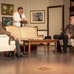 Curt Shriner, right, acts during rehearsal for The Curious Savage at the Historic Everett Theatre in Everett, Washington on Wednesday, July 24, 2024. Behind him on the left is a drawing of his late wife Laura Shriner, left, and granddaughter Veronica Osburn-Calhoun, right. (Annie Barker / The Herald)